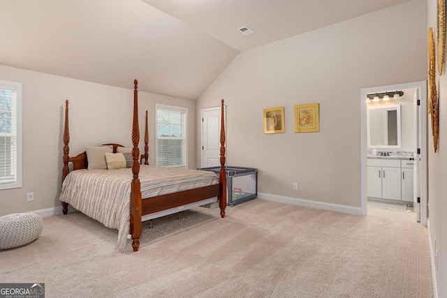 bedroom with light carpet, vaulted ceiling, visible vents, and baseboards