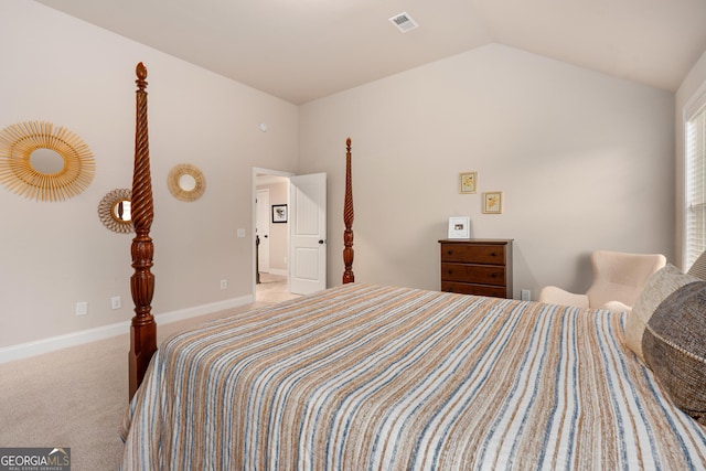 carpeted bedroom with lofted ceiling, baseboards, and visible vents