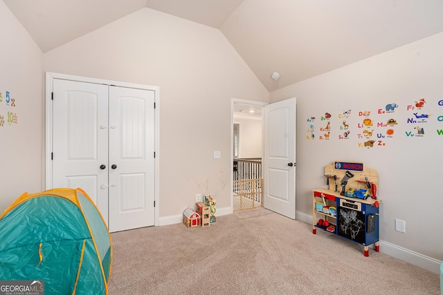 game room featuring carpet floors, vaulted ceiling, and baseboards