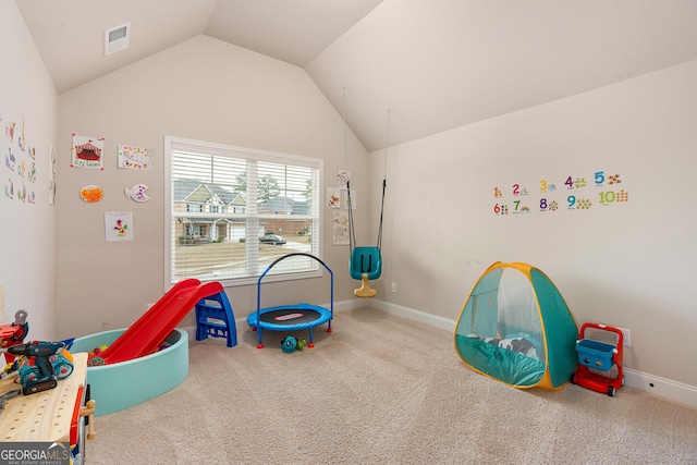 game room with baseboards, visible vents, vaulted ceiling, and carpet flooring