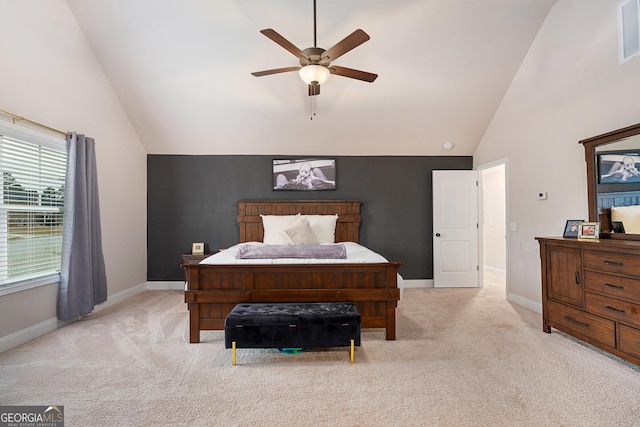 carpeted bedroom with high vaulted ceiling, ceiling fan, and baseboards