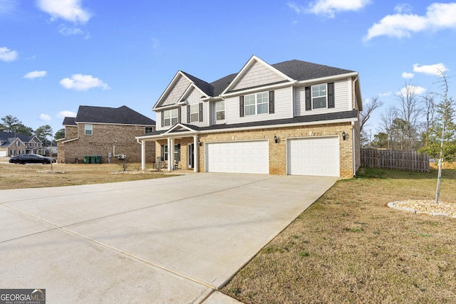 view of front of home with brick siding, concrete driveway, an attached garage, a front yard, and fence