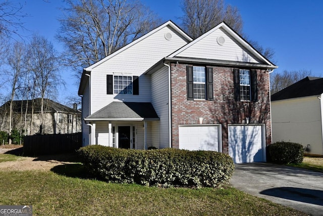 traditional home with driveway, a garage, fence, and brick siding