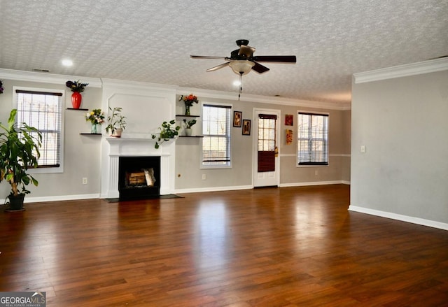 unfurnished living room featuring a fireplace with flush hearth, a ceiling fan, baseboards, and wood finished floors