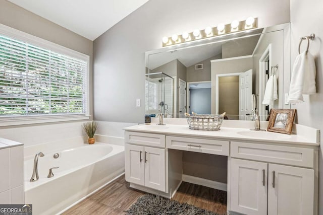 full bath with a garden tub, a stall shower, a sink, and visible vents