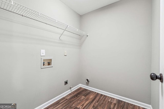 clothes washing area featuring hookup for a washing machine, laundry area, dark wood-type flooring, baseboards, and electric dryer hookup