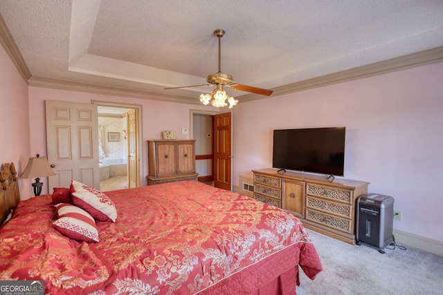 bedroom featuring baseboards, carpet, a tray ceiling, crown molding, and a textured ceiling