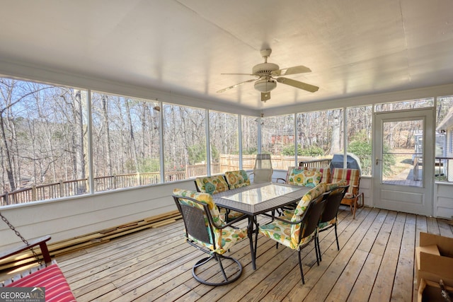 sunroom featuring ceiling fan