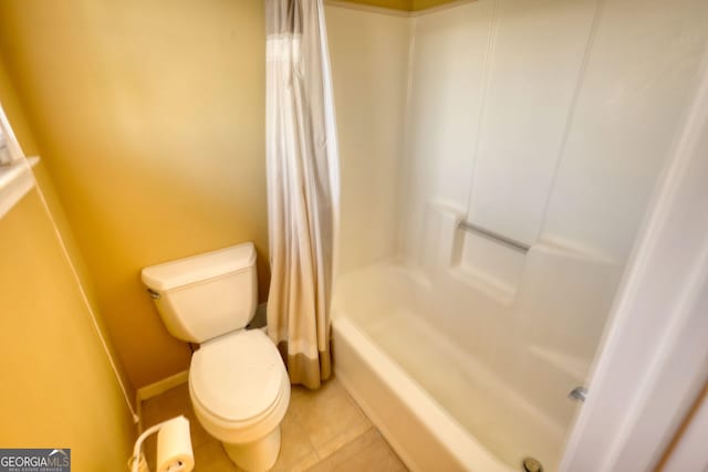 bathroom with toilet, shower / bath combination with curtain, and tile patterned floors