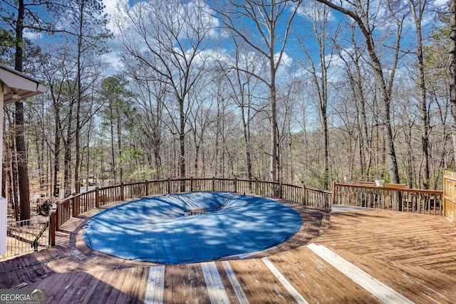 wooden deck featuring a wooded view