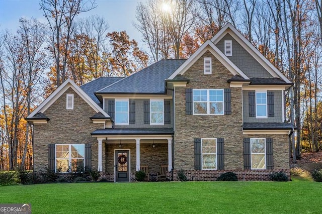 craftsman house with a front lawn