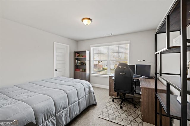 bedroom with carpet, visible vents, and baseboards