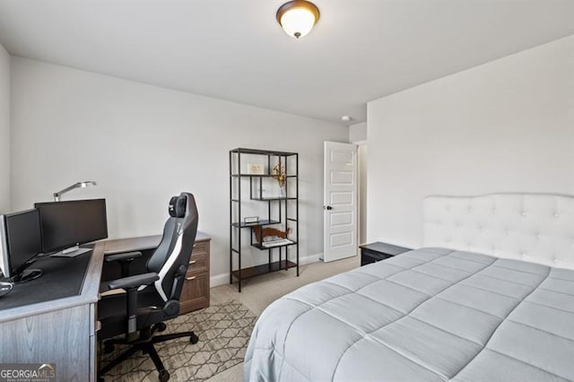 bedroom with light carpet and baseboards