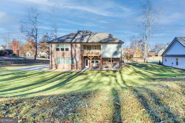 exterior space featuring a front yard and brick siding