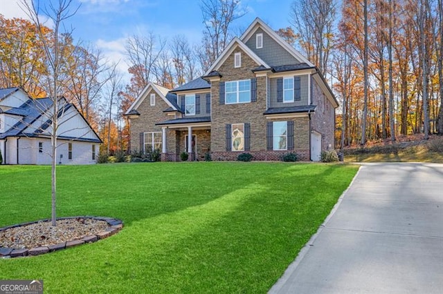 craftsman house with a front lawn