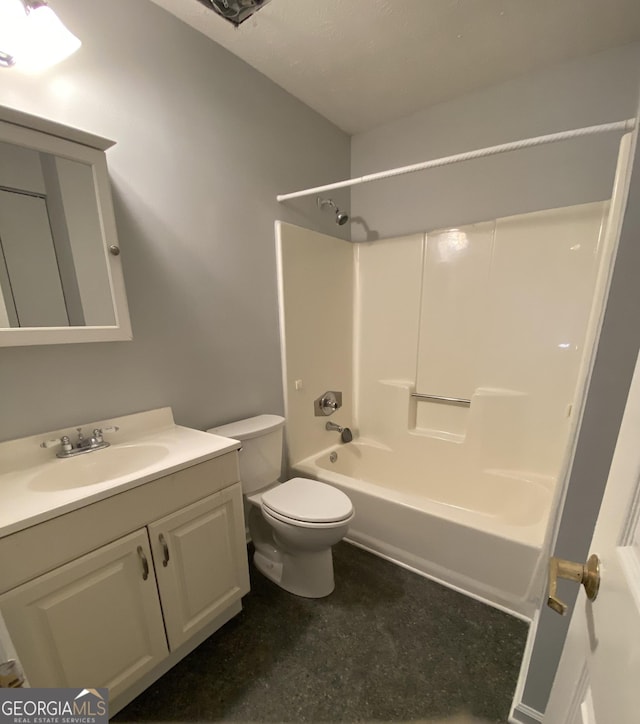 bathroom featuring shower / bathing tub combination, vanity, and toilet