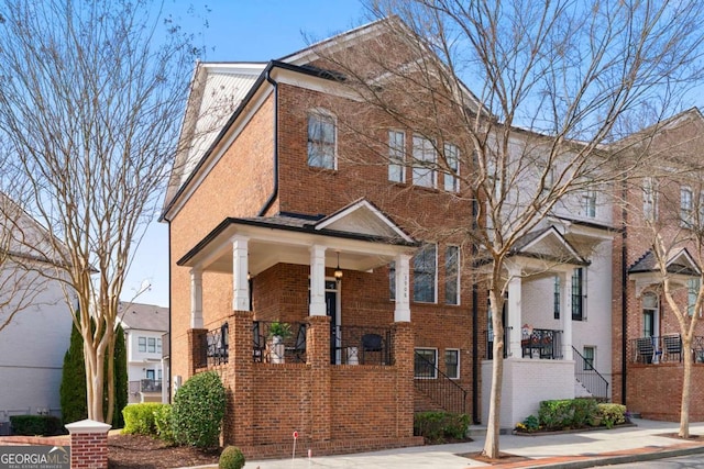 townhome / multi-family property with brick siding