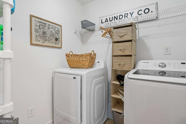 clothes washing area with laundry area and washer and dryer