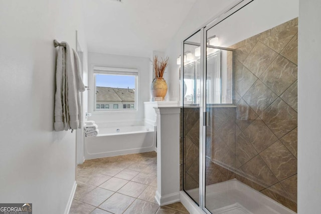 bathroom with tile patterned flooring, a shower stall, baseboards, and a bath