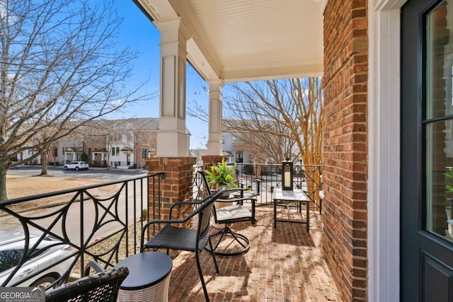 balcony featuring a residential view