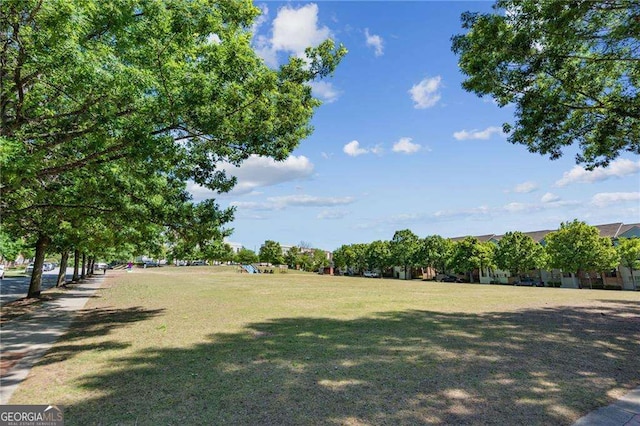 view of home's community with a yard