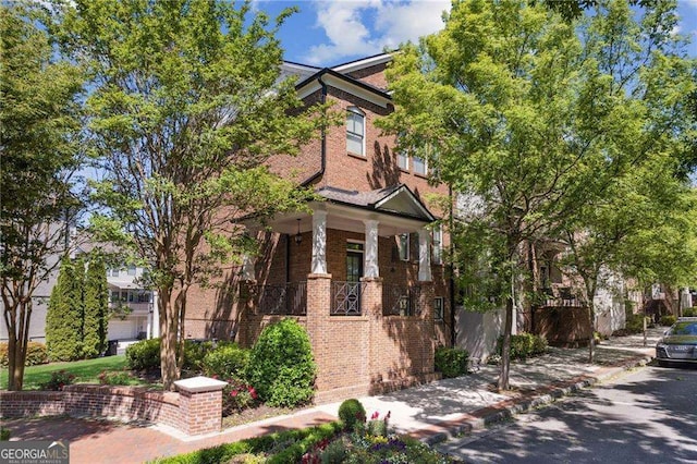 view of property exterior with brick siding