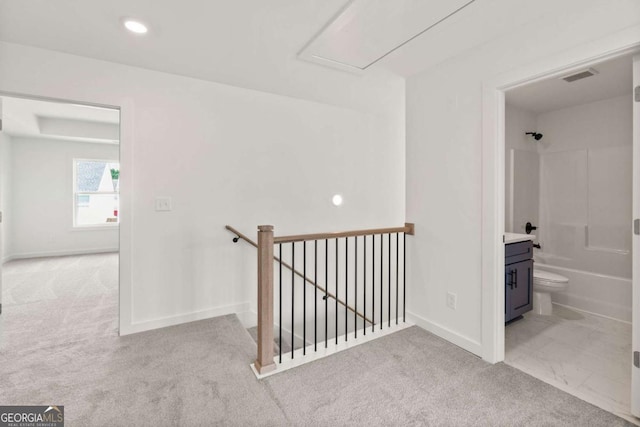 hallway with recessed lighting, visible vents, an upstairs landing, baseboards, and carpet