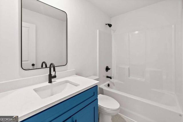 full bathroom featuring toilet, tile patterned flooring, washtub / shower combination, and vanity