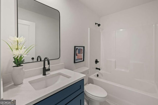 bathroom featuring toilet,  shower combination, and vanity