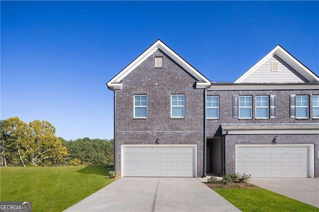 view of front of property with driveway, a garage, and brick siding