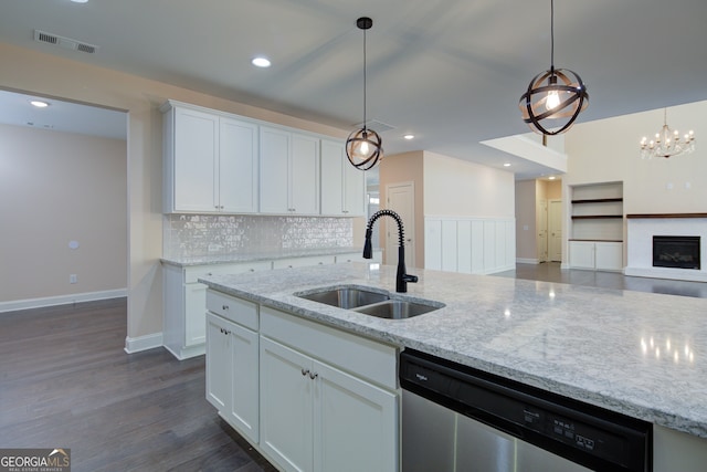 6650 Canyon Cv, Cumming, GA 30028 - kitchen featuring dishwasher, a sink, white cabinetry, decorative backsplash, and decorative light fixtures