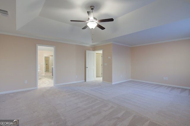 6650 Canyon Cv, Cumming, GA 30028 - spare room with a raised ceiling, light colored carpet, a ceiling fan, crown molding, and baseboards