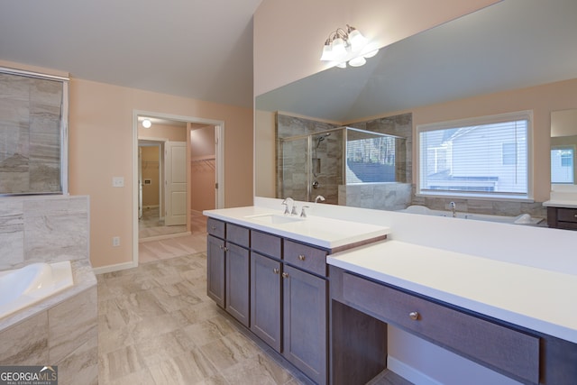 6650 Canyon Cv, Cumming, GA 30028 - full bathroom featuring a stall shower, lofted ceiling, vanity, a garden tub, and a walk in closet