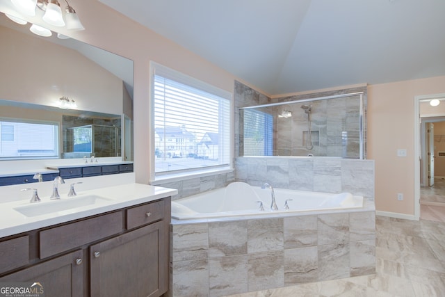 6650 Canyon Cv, Cumming, GA 30028 - bathroom featuring a shower stall, a garden tub, vaulted ceiling, and vanity