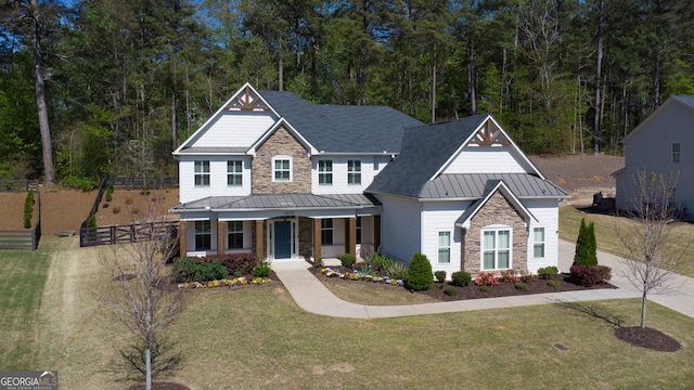 6650 Canyon Cv, Cumming, GA 30028 - craftsman inspired home with a standing seam roof, stone siding, covered porch, and metal roof