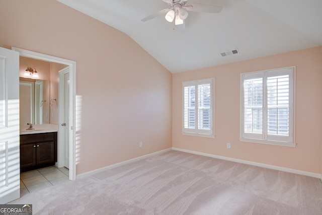 6650 Canyon Cv, Cumming, GA 30028 - unfurnished bedroom featuring lofted ceiling, light carpet, baseboards, and ensuite bathroom