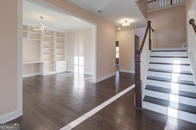 6650 Canyon Cv, Cumming, GA 30028 - stairway featuring wood finished floors, baseboards, and a chandelier