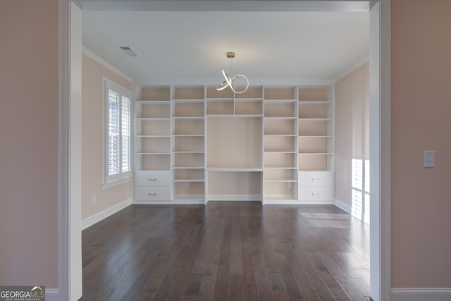 6650 Canyon Cv, Cumming, GA 30028 - spare room with crown molding, dark wood-type flooring, a chandelier, and baseboards
