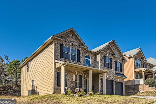 view of front of house featuring covered porch and a garage