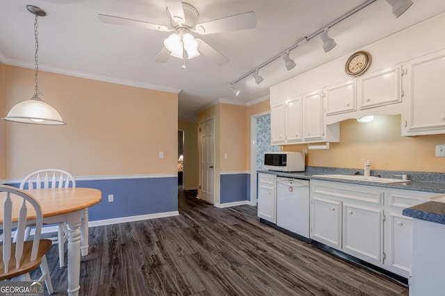 kitchen with dark wood-style floors, white appliances, white cabinetry, and a sink