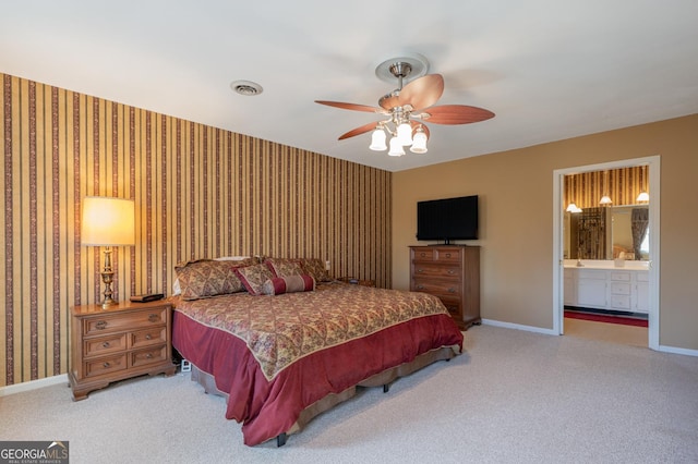 bedroom featuring wallpapered walls, carpet, visible vents, and baseboards