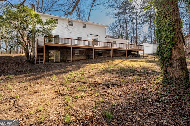 back of house with stairway and a wooden deck