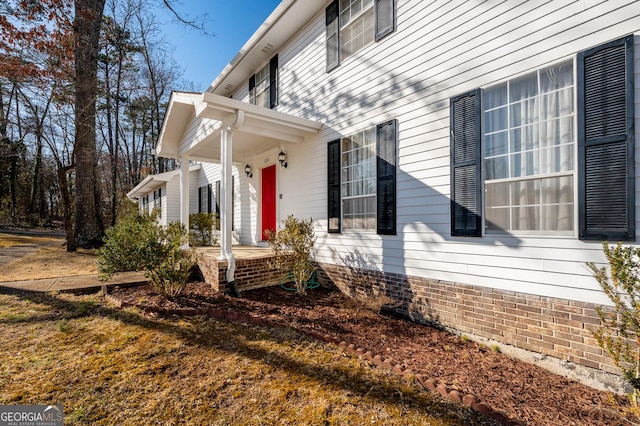 view of side of home featuring a porch