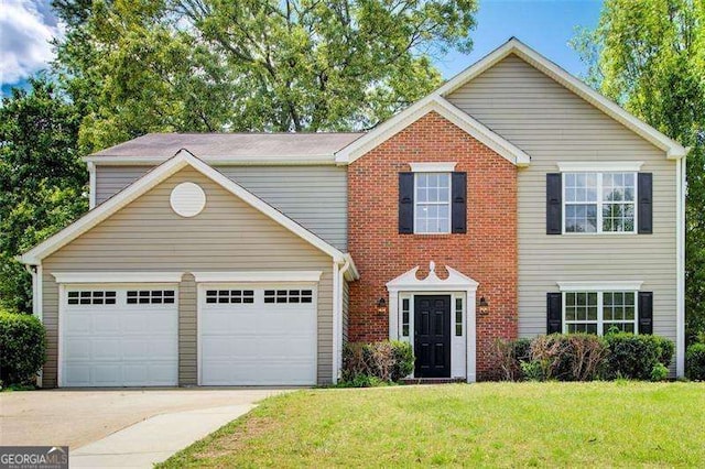 view of front of house with a garage, brick siding, driveway, and a front lawn