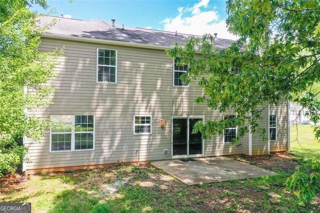 rear view of property featuring a patio