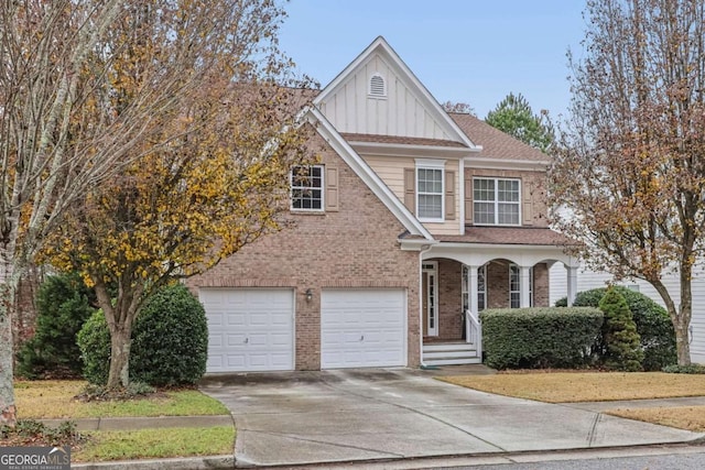 view of front facade with brick siding, a shingled roof, concrete driveway, board and batten siding, and a garage