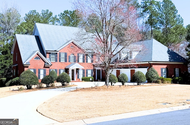 view of front of home featuring brick siding