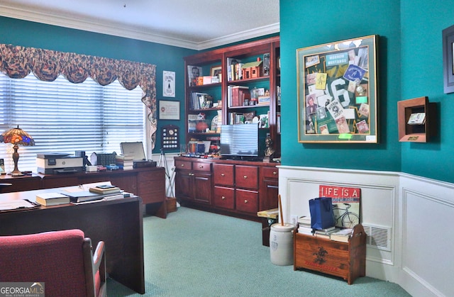 carpeted office space with a wainscoted wall and ornamental molding