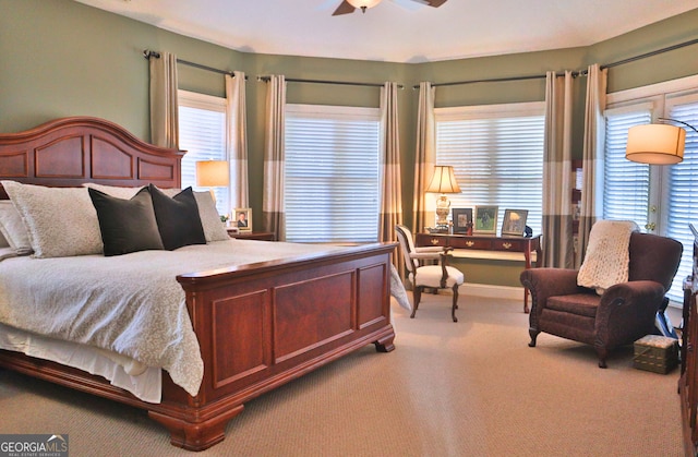 carpeted bedroom with baseboards