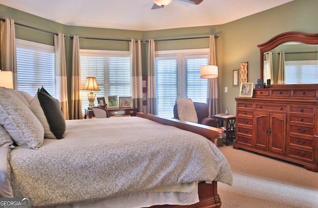 carpeted bedroom with ceiling fan